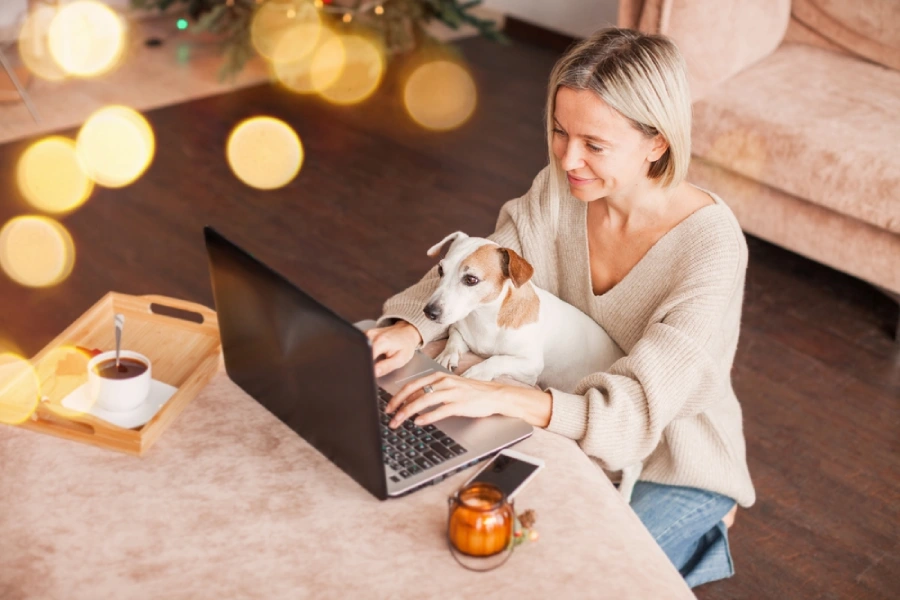 Woman and dog using a laptop